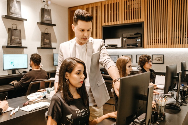 Man teaching woman